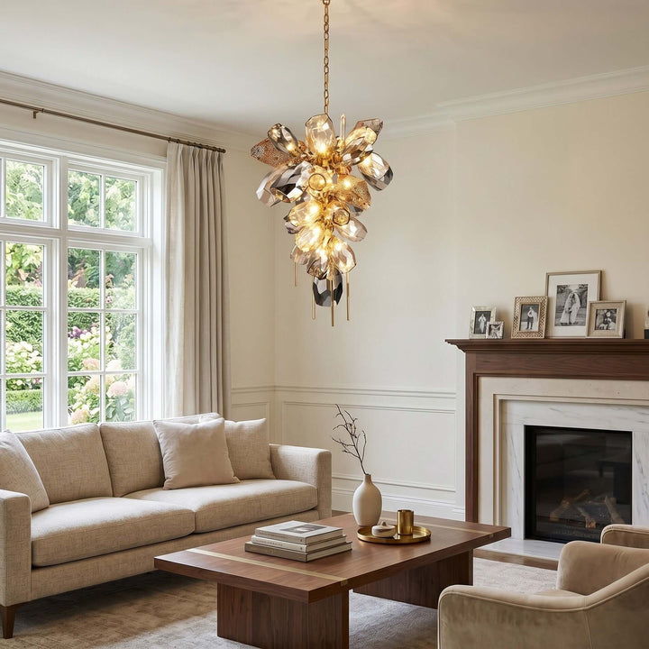 Vertical Britannica chandelier with clustered glass shades in a living room with a fireplace.