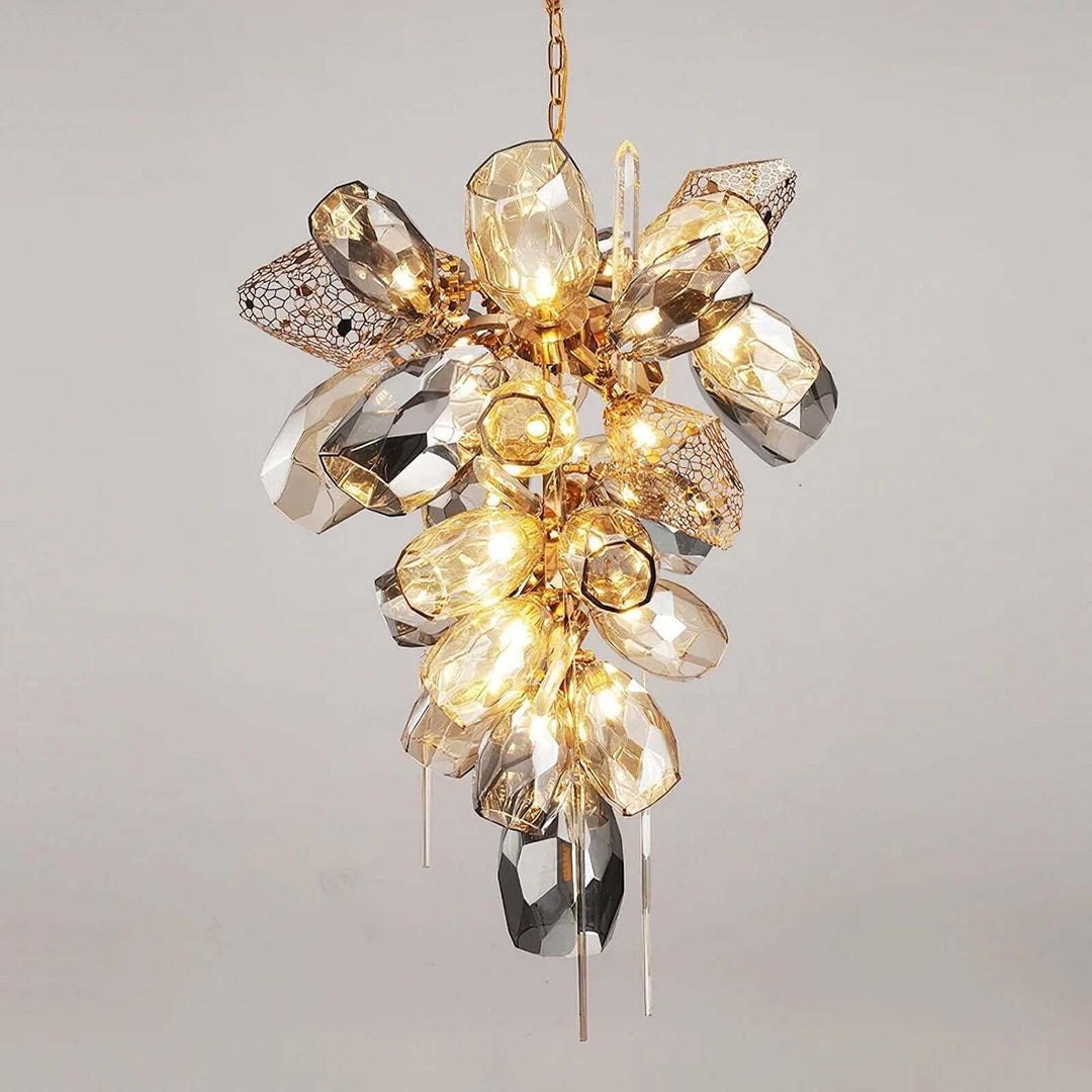 Front view of the vertical Britannica chandelier with clustered gray and clear glass shades.