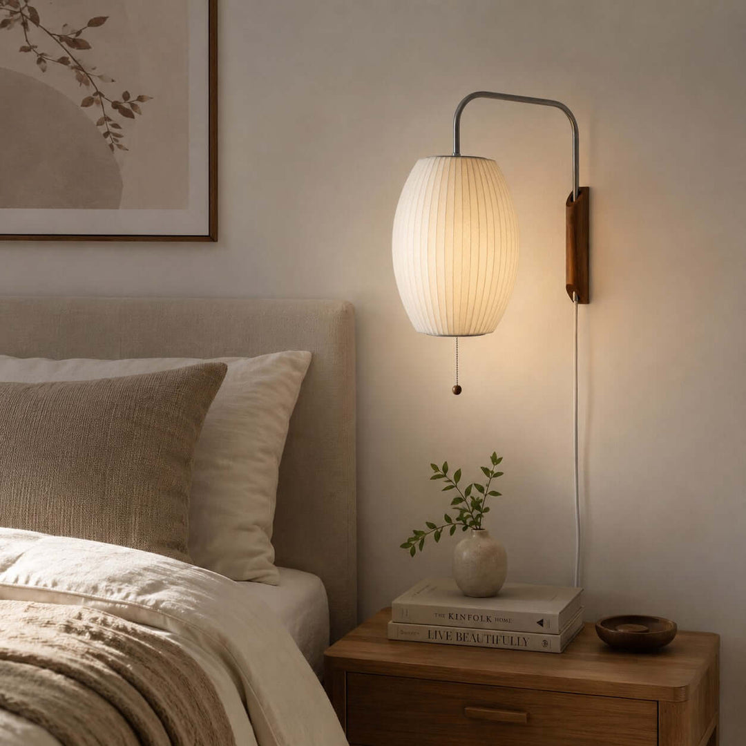 Glowing Bubble Ball wall sconce beside a wood nightstand in a warm neutral bedroom