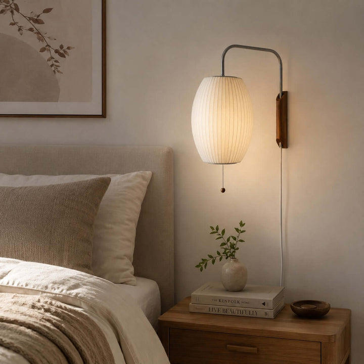 Glowing Bubble Ball wall sconce beside a wood nightstand in a warm neutral bedroom
