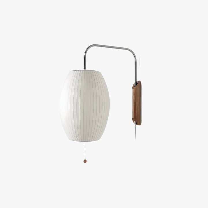 Bubble Ball wall sconce with an oval white ribbed shade, walnut base, and curved metal arm