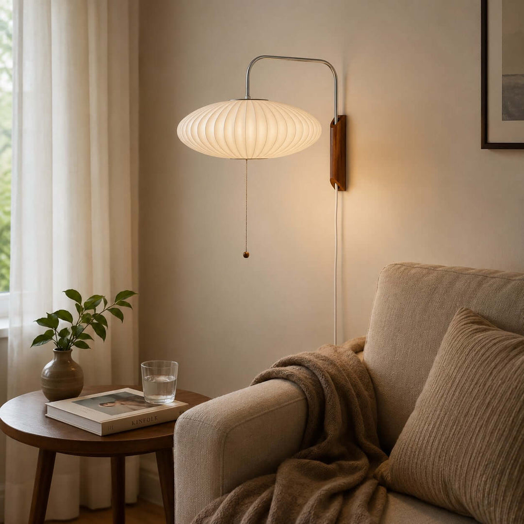 Wide Bubble Ball wall sconce beside an upholstered reading chair and round side table