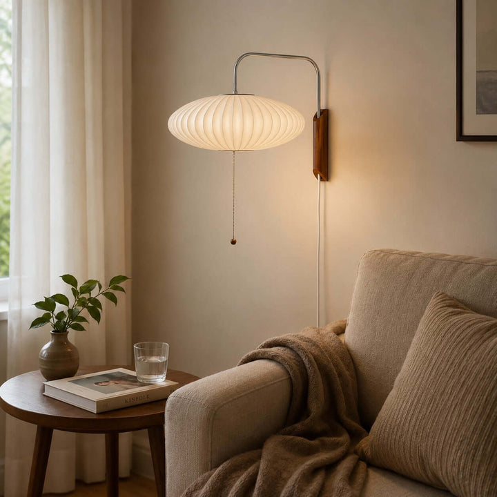 Wide Bubble Ball wall sconce beside an upholstered reading chair and round side table