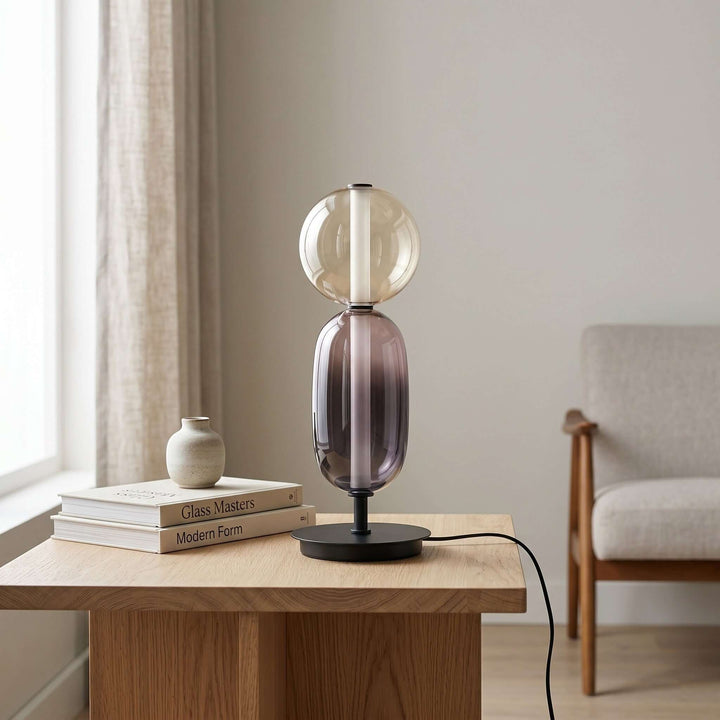 Candied Model A glass accent lamp with clear globe and smoked body styled with books and pottery