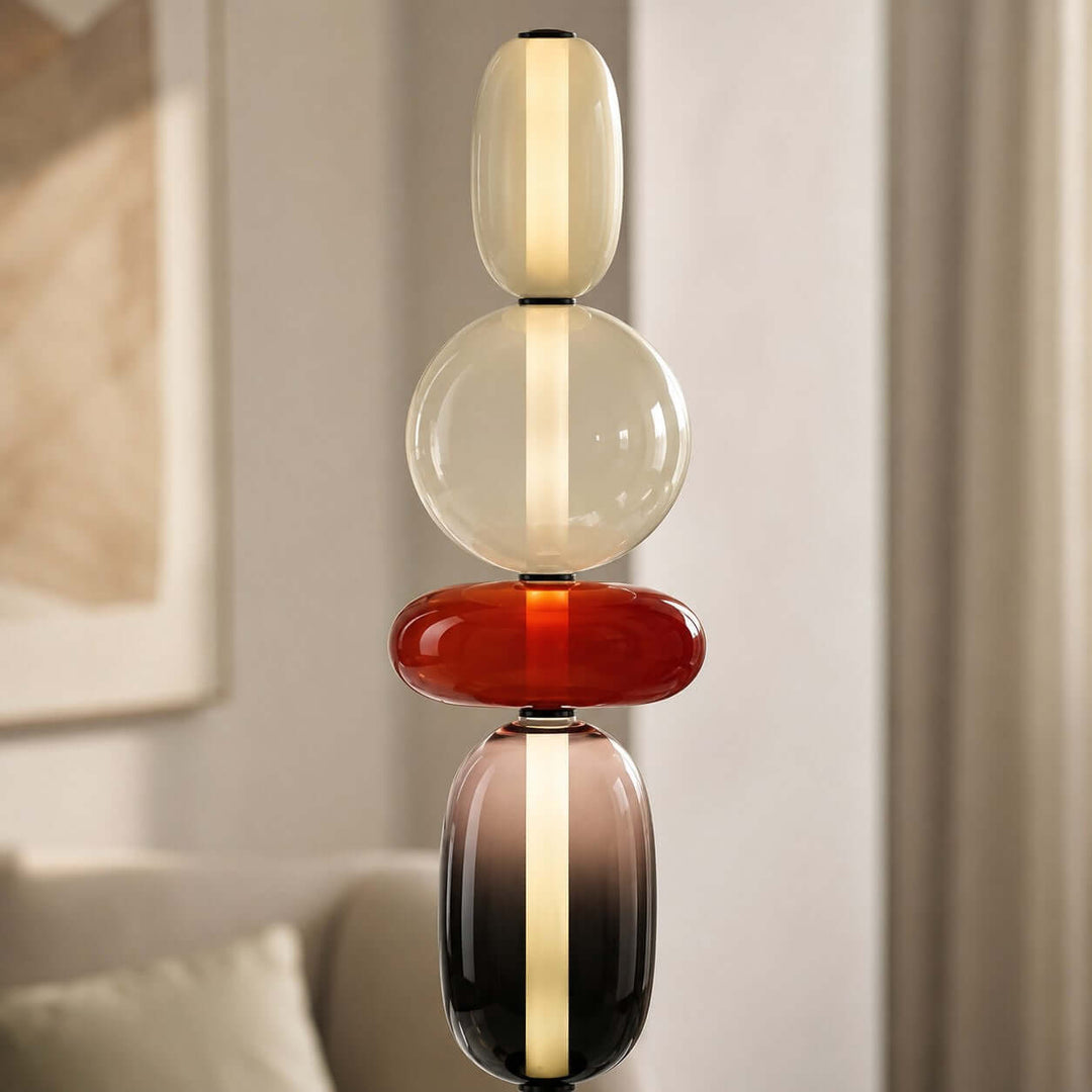 Close-up of the Candied Model A Red floor lamp with clear, red, and smoky hand-blown glass forms.