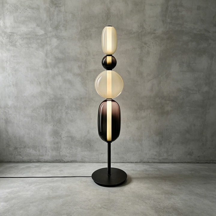 Standard-height Candied Model B Black floor lamp with a black sphere and clear stacked glass shades.