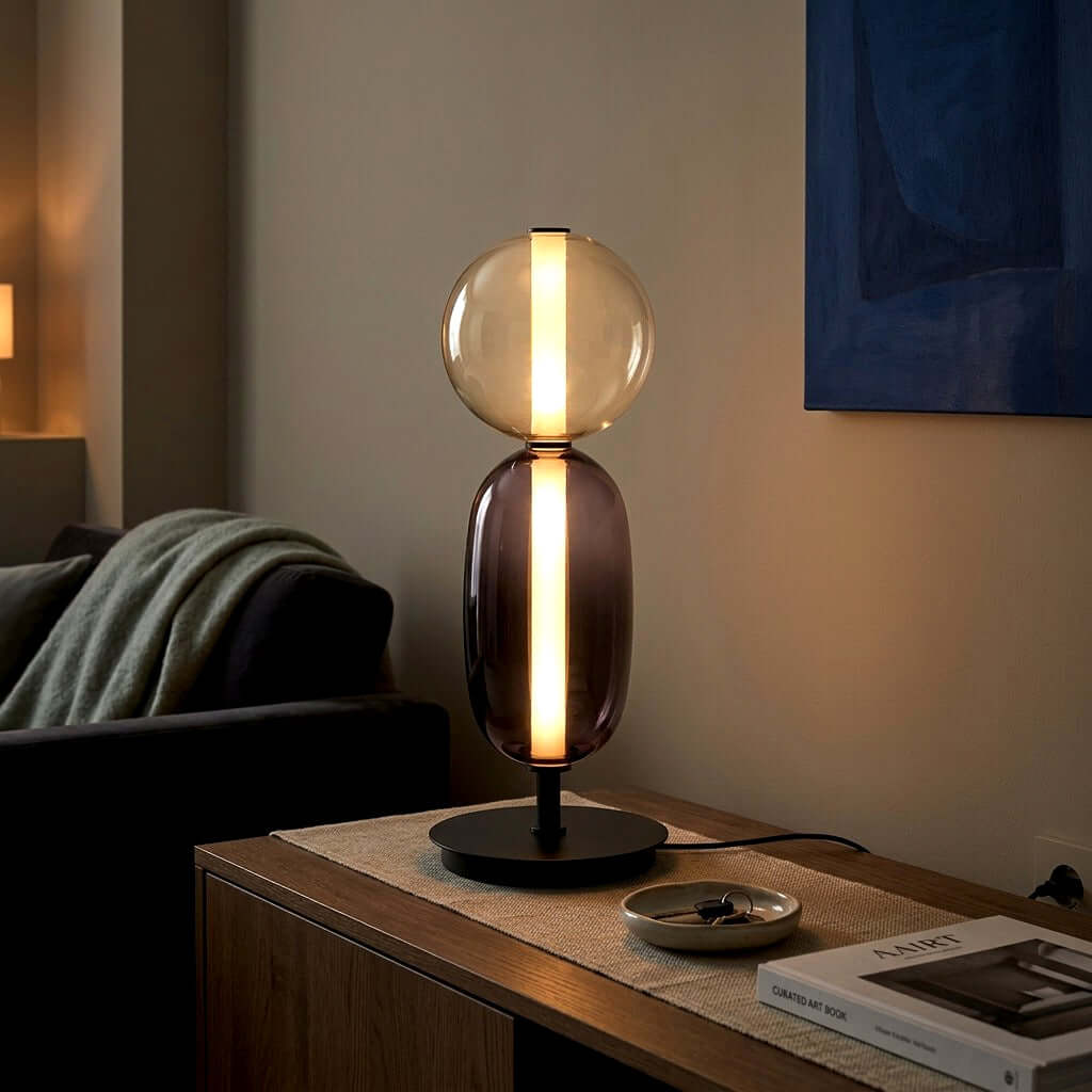 Red and smoked glass bedside lamp casting warm ambient light in a modern bedroom at night