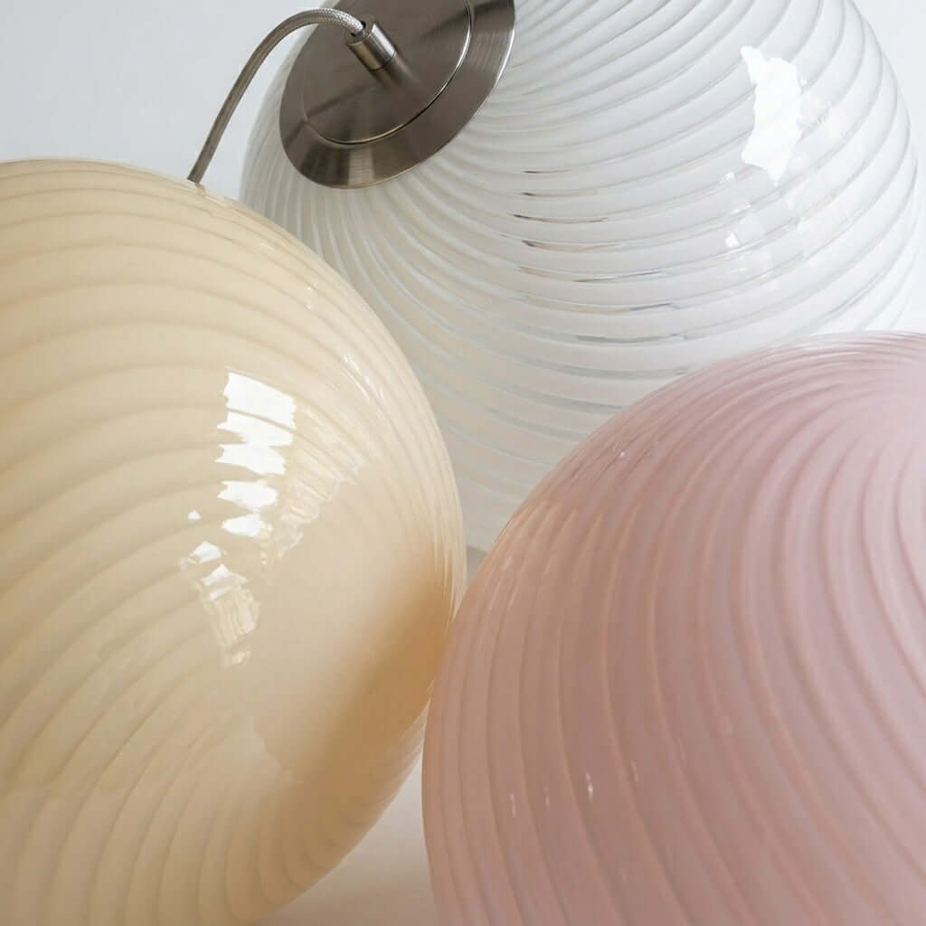 Close-up of yellow, white, and pink ribbed glass shades for the Candy Pendant Light.