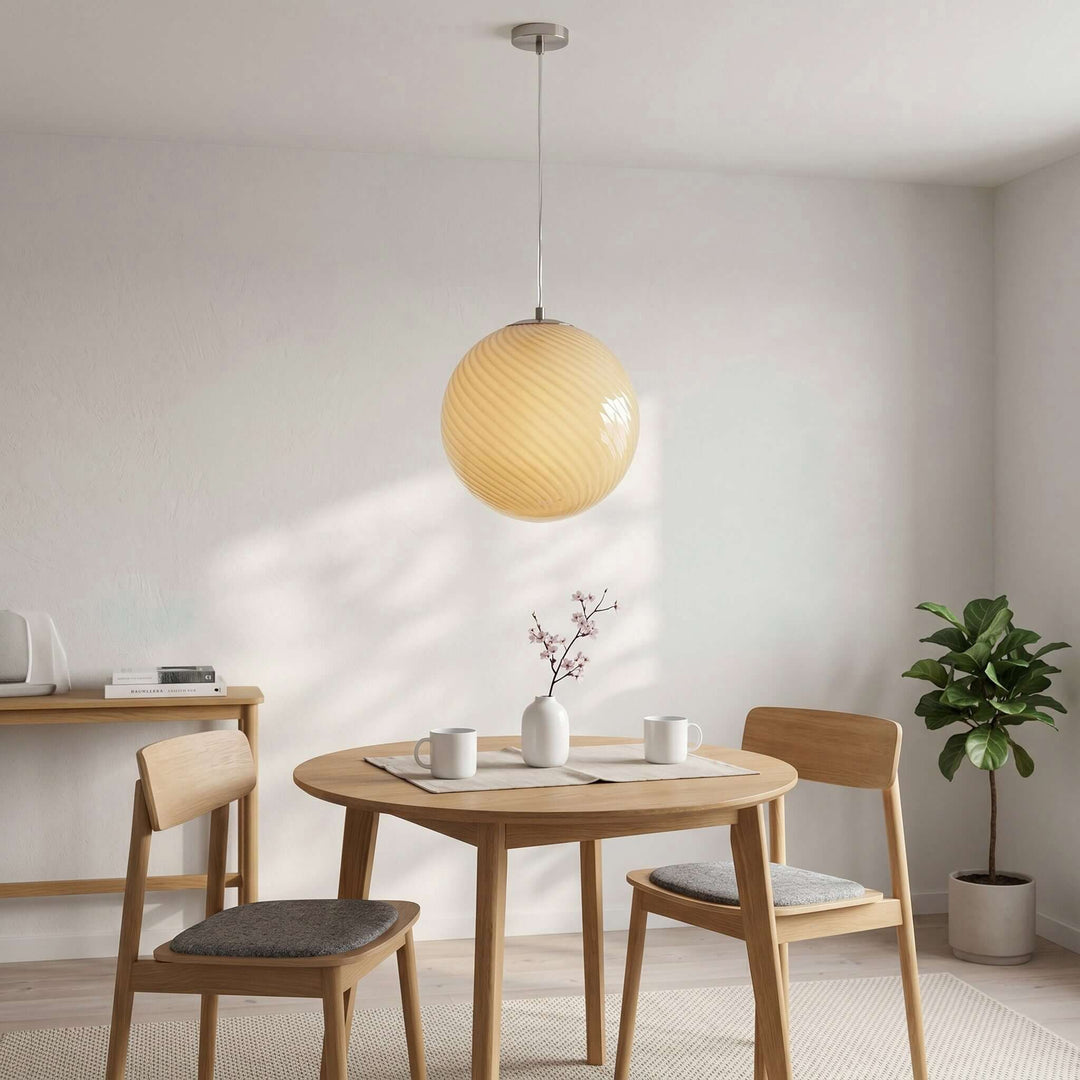 Yellow Candy Glass Pendant Light above a round dining table in a sunlit modern dining room.