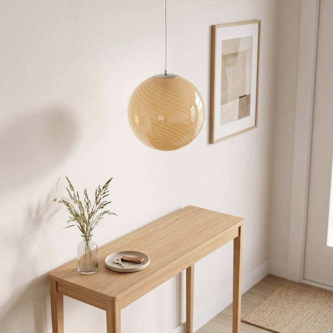 Yellow Candy Glass Pendant Light hanging above an entryway console table in a minimalist hallway.