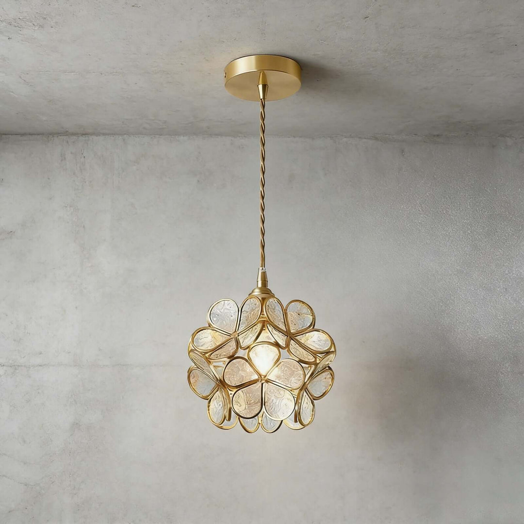 Clear textured glass petal pendant light with floral shade and antique brass frame
