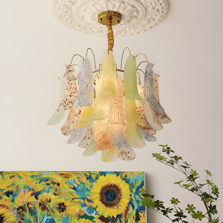 Colorful Murano glass chandelier mounted beneath an ornate ceiling medallion