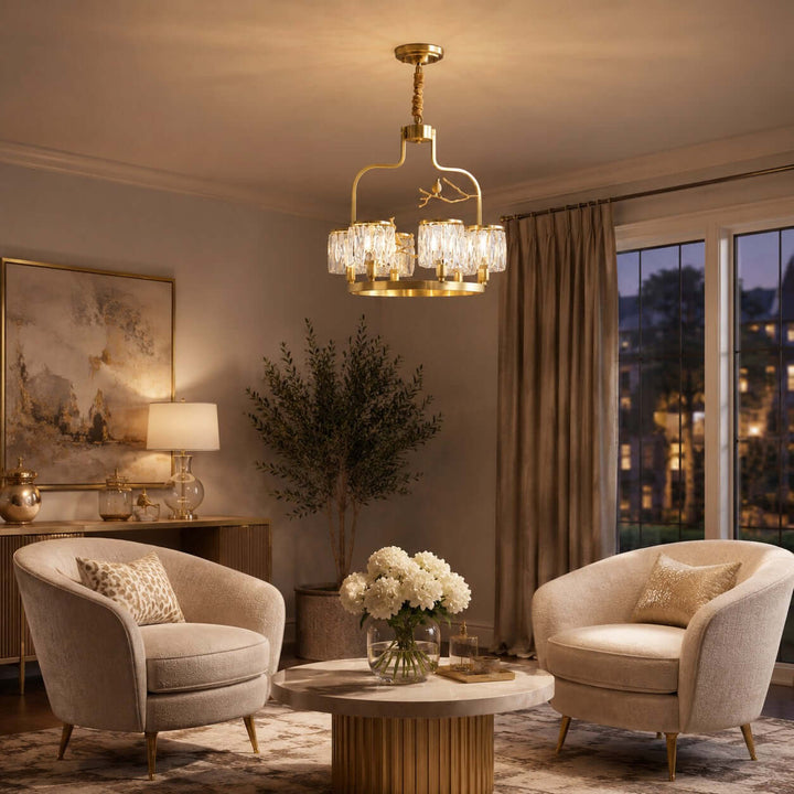 Crystal Bird Chandelier casting warm light in an evening living room with two curved lounge chairs