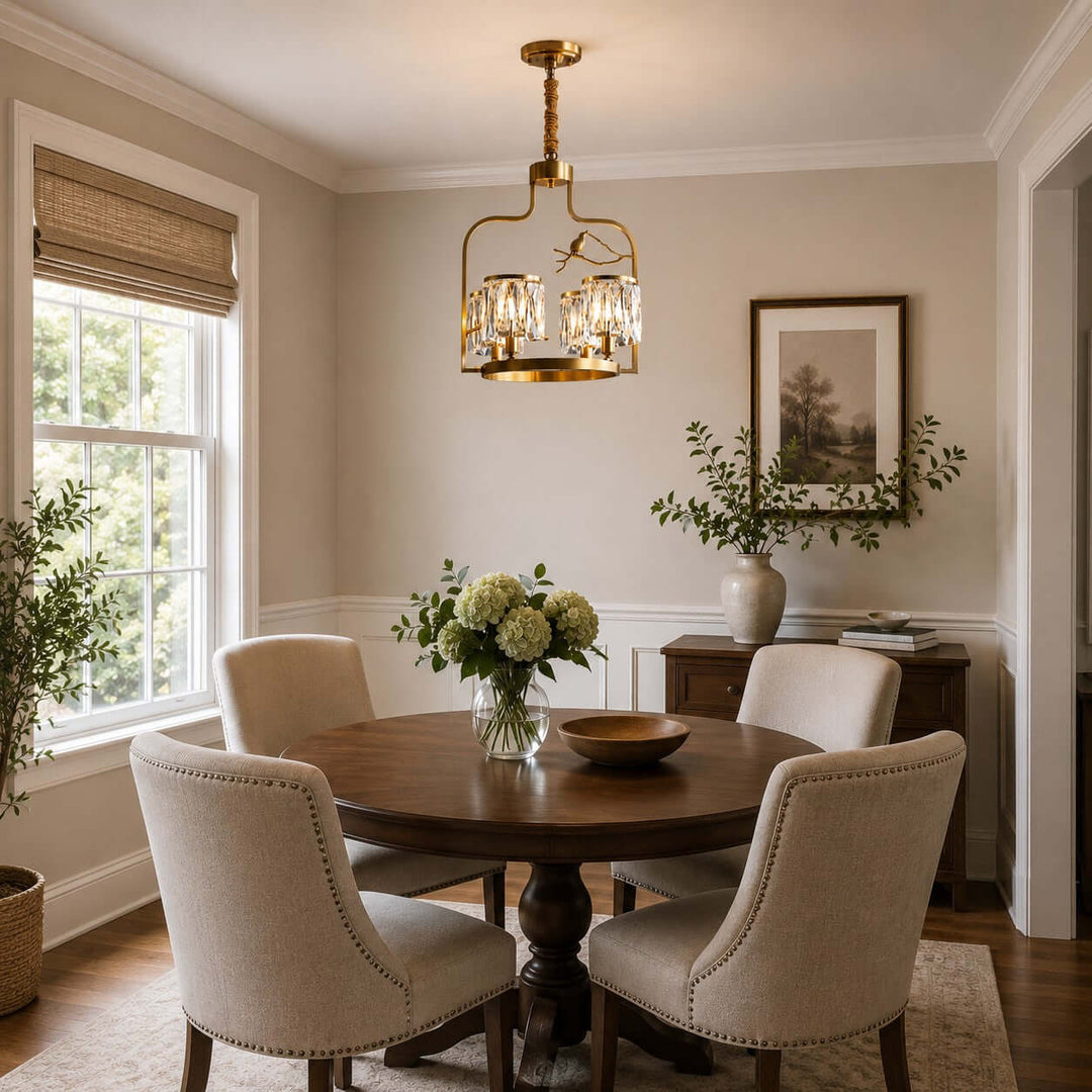 Four-light Crystal Bird dining room chandelier above a round wood table in a softly lit neutral space