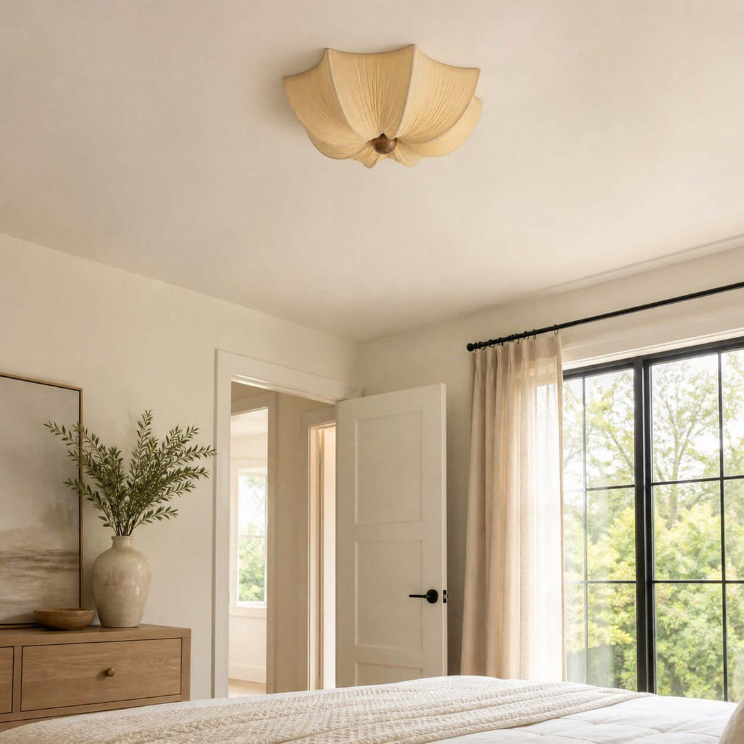 Fabric and wood bedroom ceiling light shown in soft natural daylight near a large window