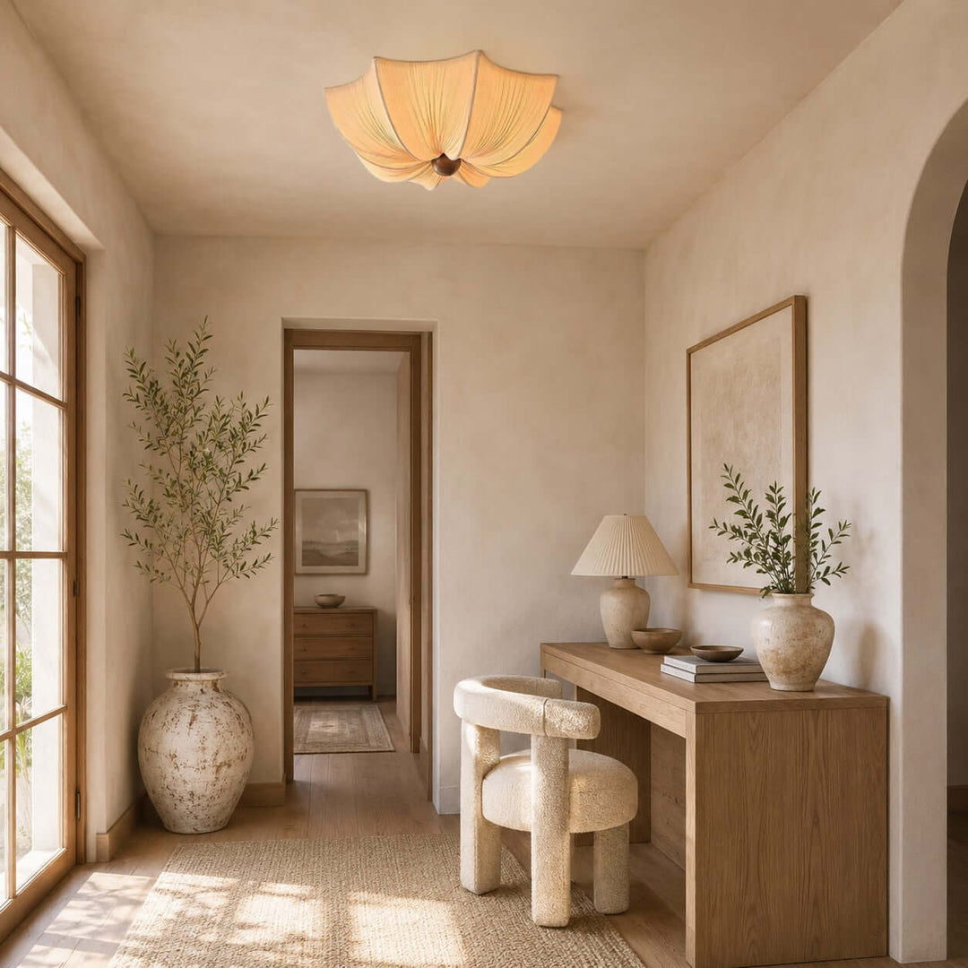 Flower-shaped fabric flush mount ceiling light in a warm hallway with a wood console desk