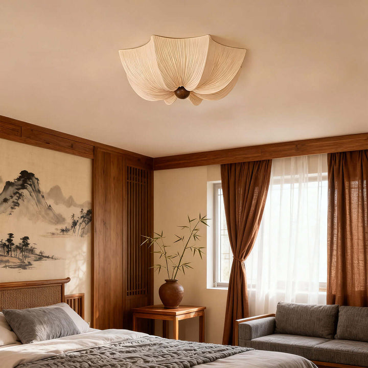 Fabric and wood flush mount ceiling light in a Japandi bedroom with warm wood wall panels