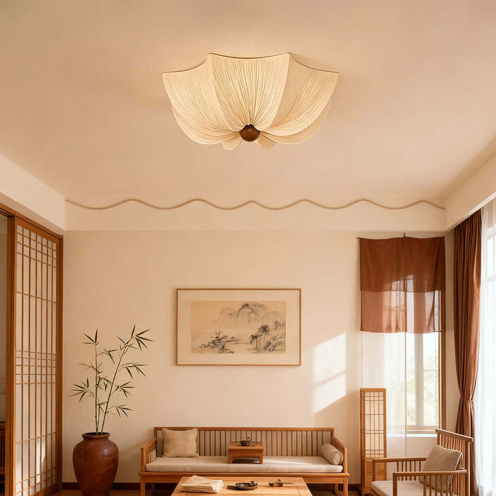 Fabric flower ceiling light in a warm Japandi living room with natural wood furniture