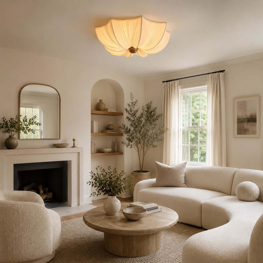 Warm fabric flower ceiling light in a neutral living room with curved modern furniture