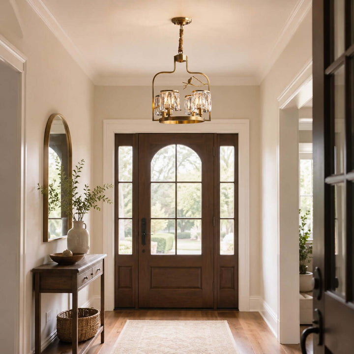 Four-light Crystal Bird Chandelier hanging in a compact front entry with a wood door and console table