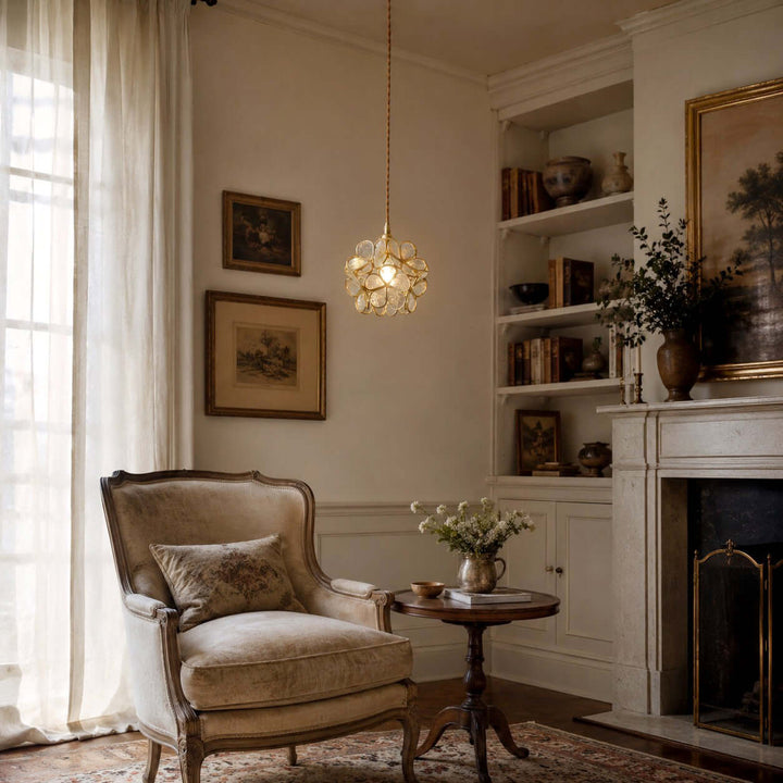 White glass petal pendant light illuminating a vintage living room reading corner