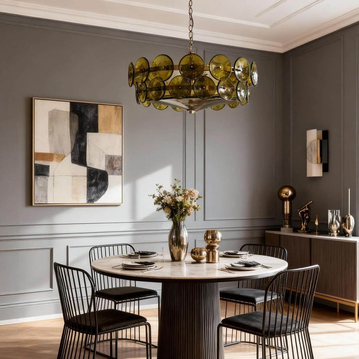 Green glass chandelier over a round dining table in a contemporary dining room