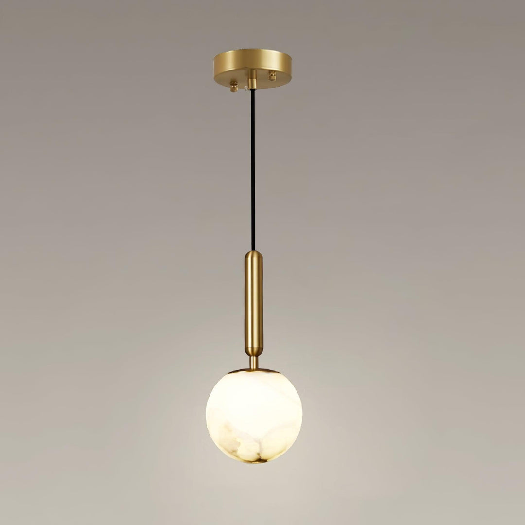 Large Bosso alabaster globe pendant light with a warm glow, brass stem, black cord, and round canopy