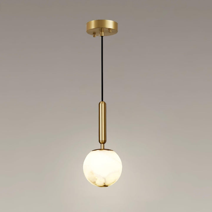 Large Bosso alabaster globe pendant light with a warm glow, brass stem, black cord, and round canopy