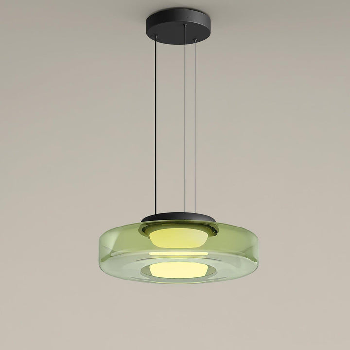 Green one-layer glass pendant light with translucent circular shade and integrated warm LED