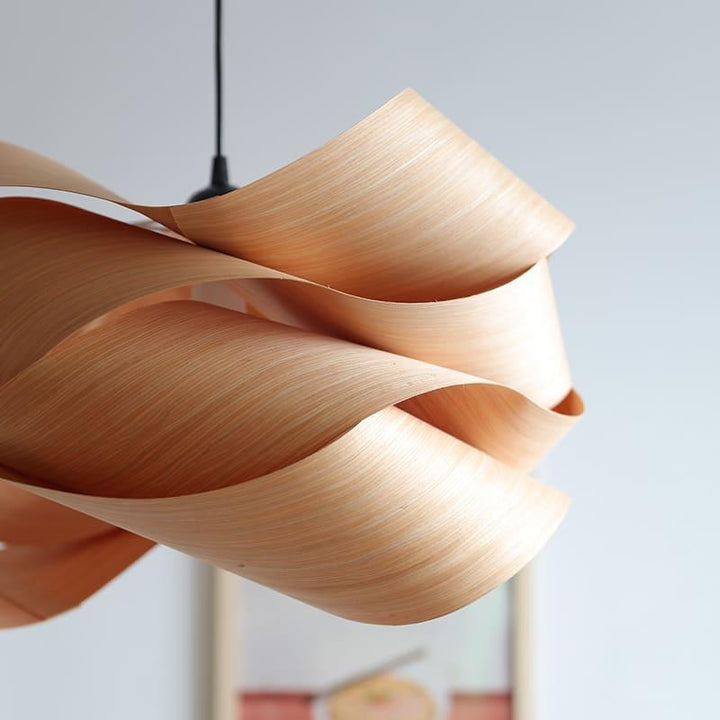 Side detail of the Link pendant light showing smooth curved wood veneer layers