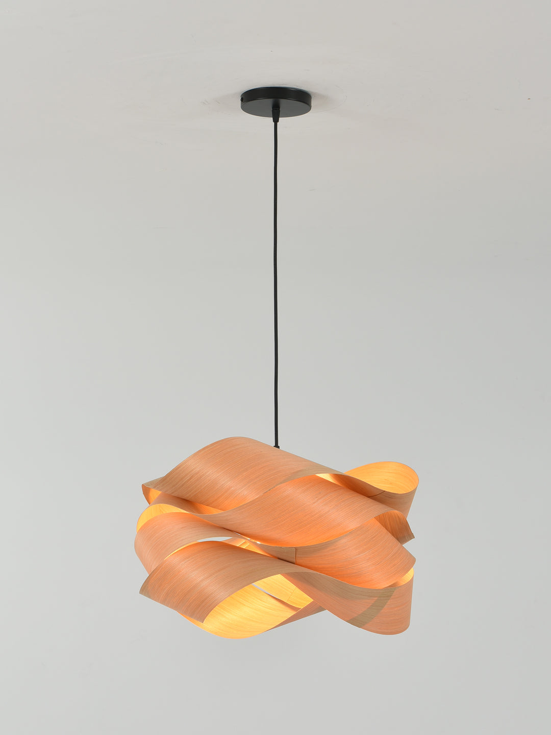 Full-length view of the Link wood pendant light with a black cord and ceiling canopy
