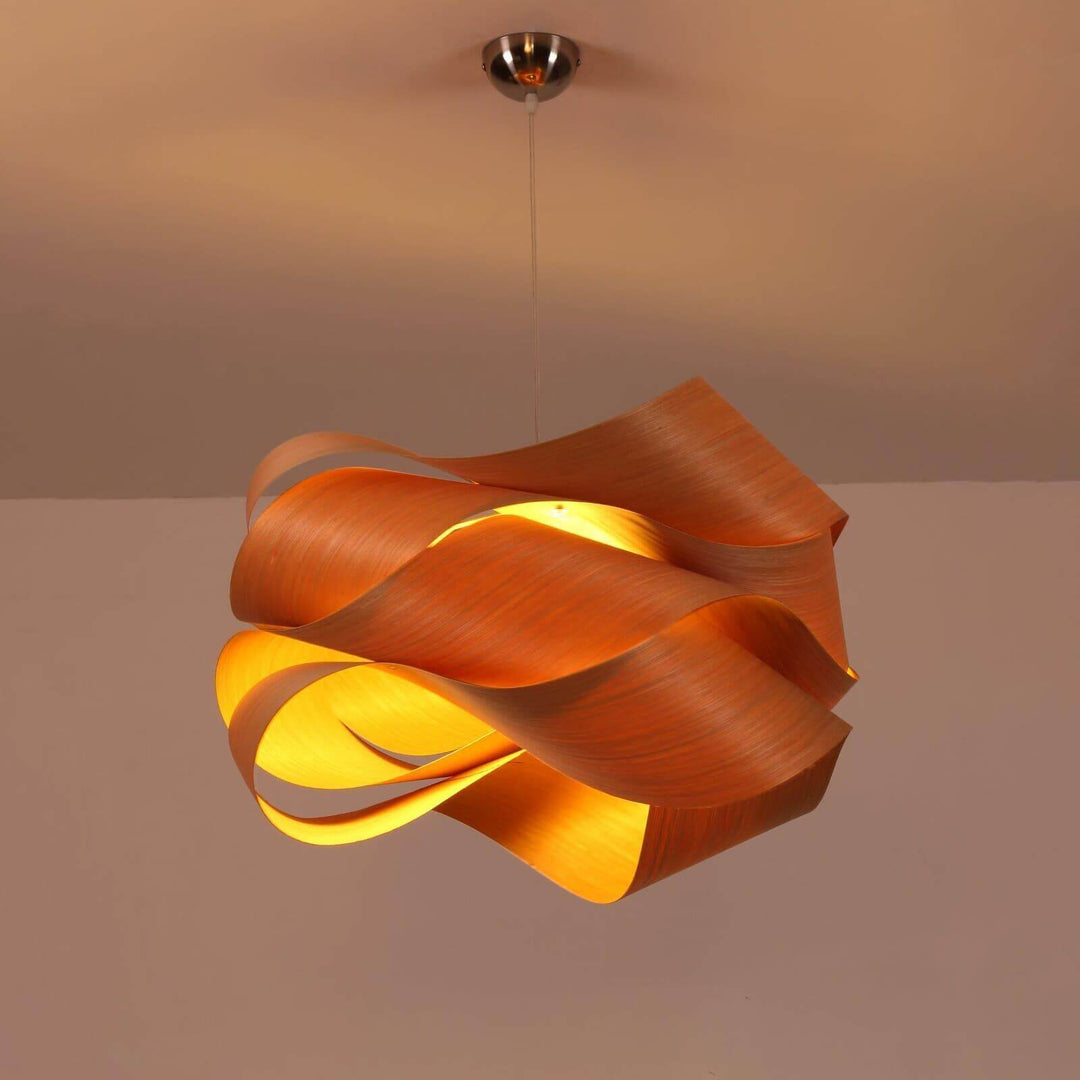 Glowing Link wood pendant light suspended from a polished metal ceiling canopy