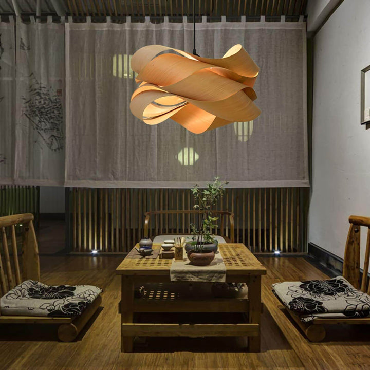 Link wood pendant light above a low table in a Japanese-style tea room