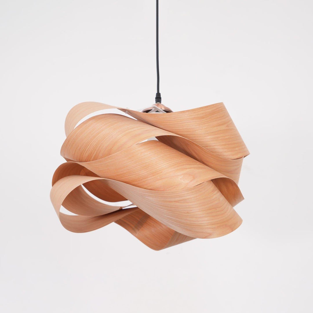 Link wood pendant light with a layered ribbon shade and black cord on a white background