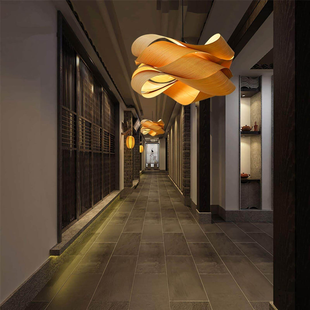 Link wood pendant lights illuminating a long corridor with dark wood screens and stone flooring