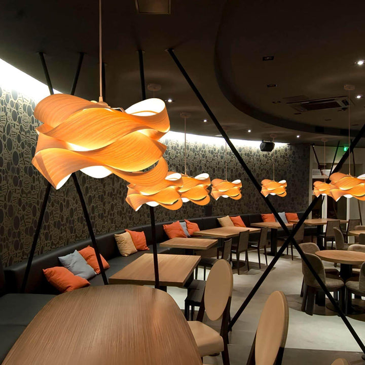 Multiple Link wood pendant lights illuminating tables in a contemporary restaurant