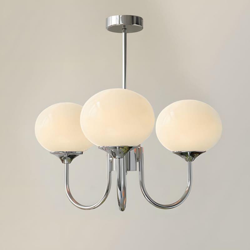 Three-light Marshmallow chandelier with a chrome frame and cream glass globes.