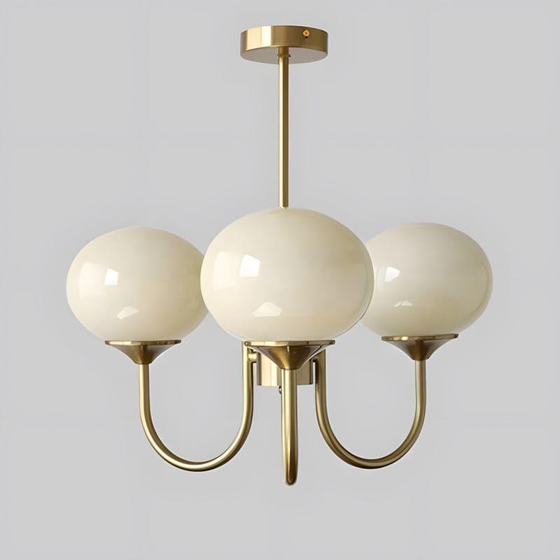 Three-light Marshmallow chandelier with a copper frame and cream glass globes.
