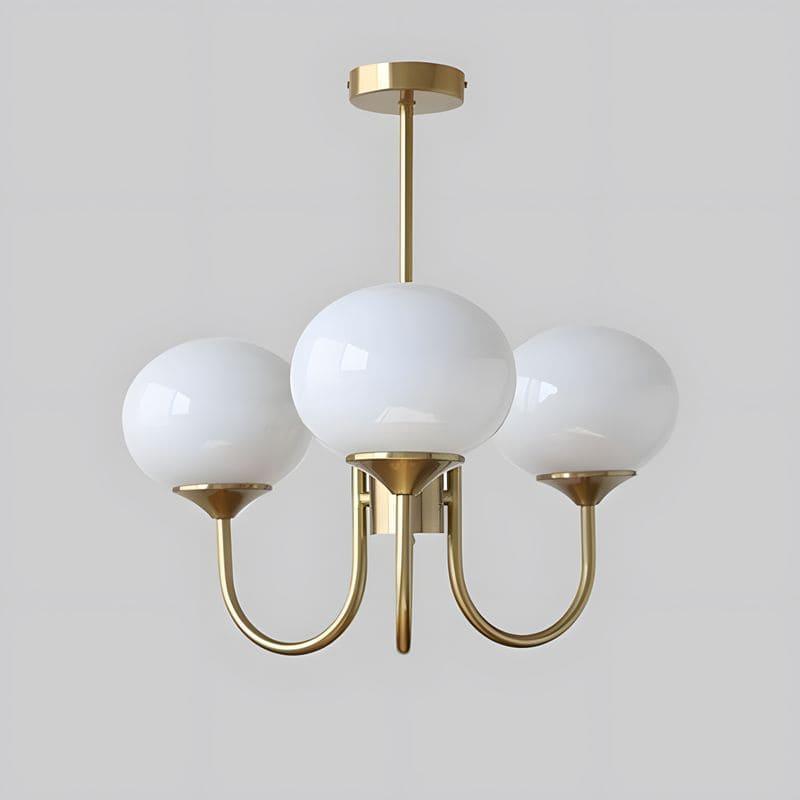 Three-light Marshmallow chandelier with a copper frame and white glass globes.
