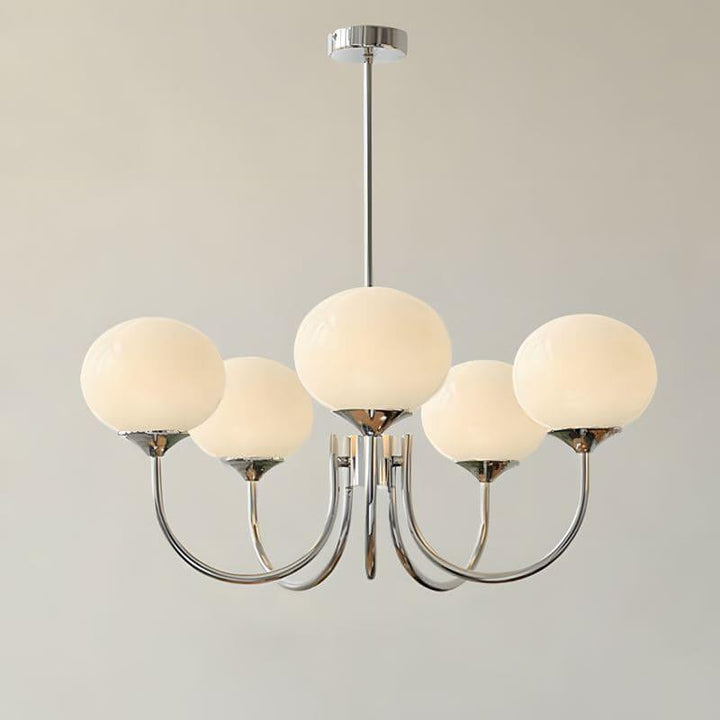 Five-light Marshmallow chandelier with a chrome frame and cream glass globes.