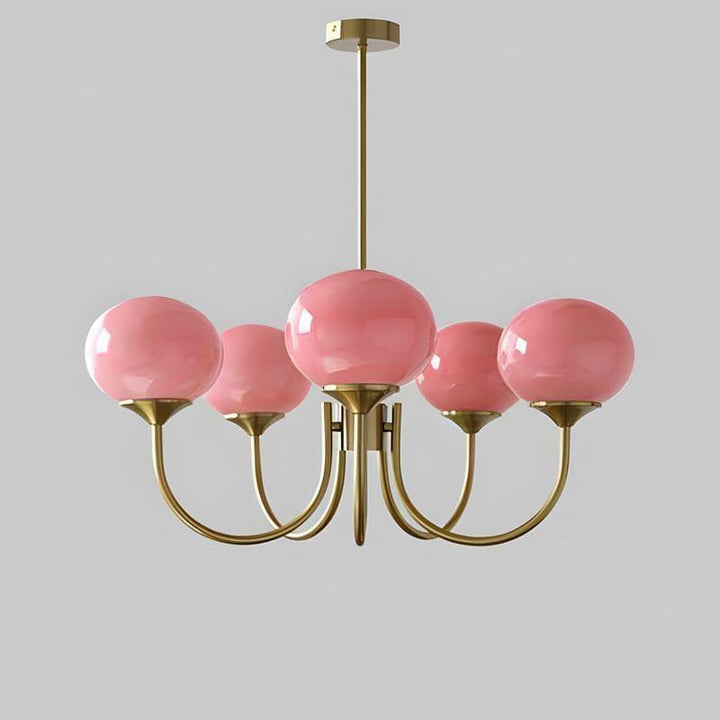 Five-light Marshmallow chandelier with a copper frame and pink glass globes.
