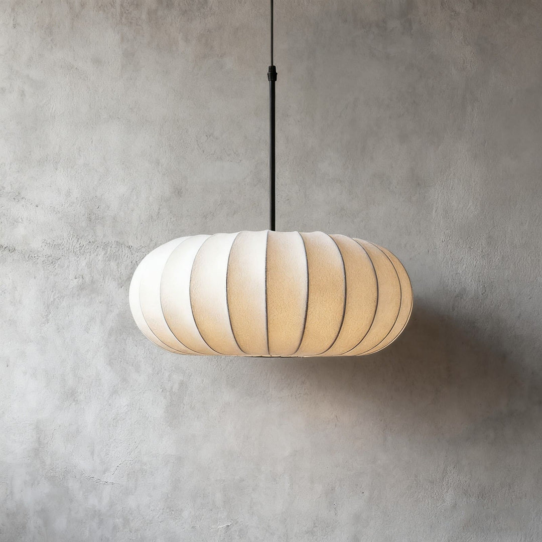 Medium Verona silk pendant light in the 15.7-inch size against a gray wall