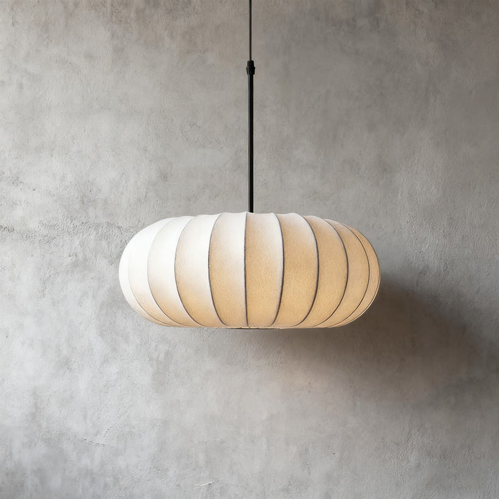 Medium Verona silk pendant light in the 15.7-inch size against a gray wall