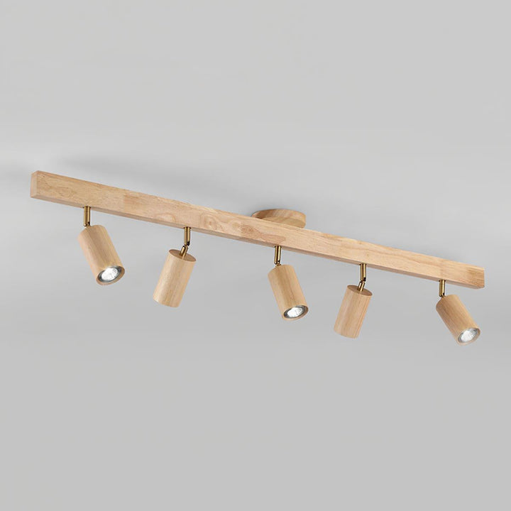 Five-head Merlo natural wood track lighting with adjustable spotlights in an angled product view