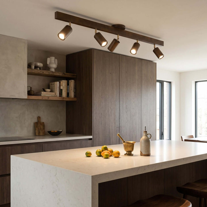 Five-head Merlo walnut wood track lighting providing focused ceiling light above a modern kitchen island