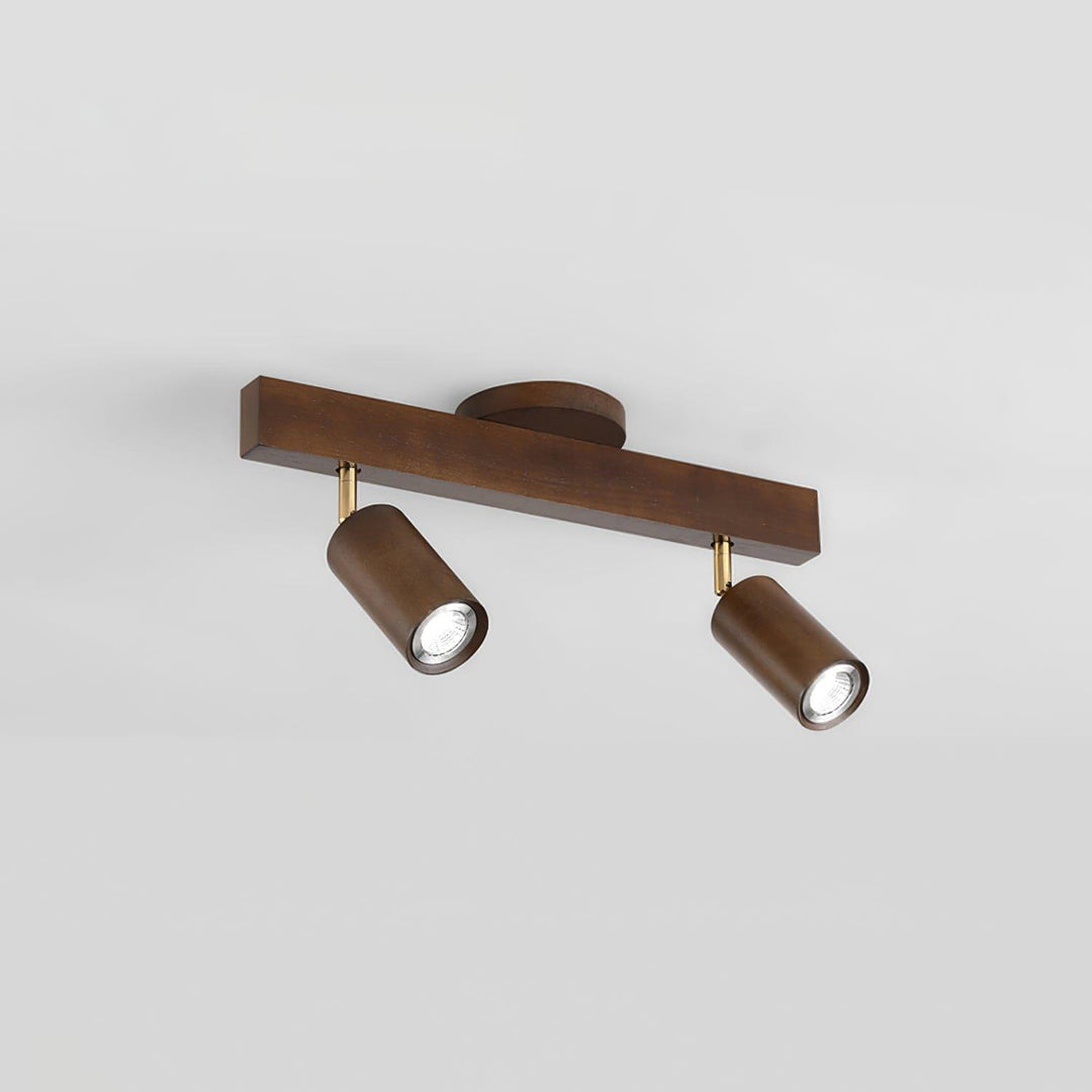 Two-head Merlo walnut wood track lighting with adjustable spotlights against a light background