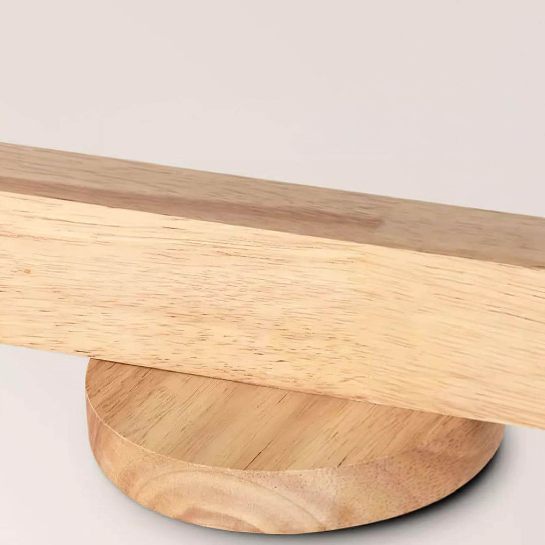 Close-up of the Merlo wood track lighting bar and round ceiling canopy showing the natural wood grain