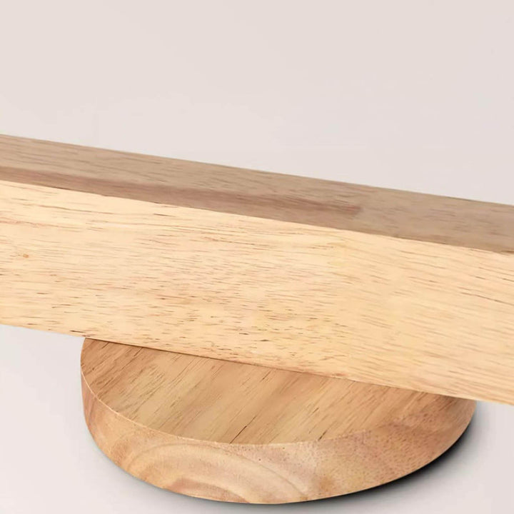 Close-up of the Merlo wood track lighting bar and round ceiling canopy showing the natural wood grain