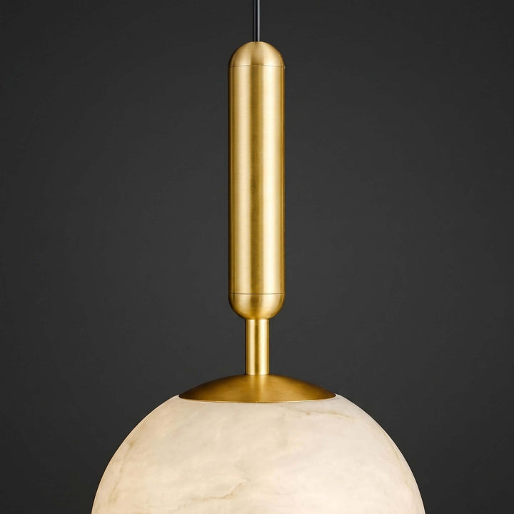 Mid-century pendant light with an elongated brass stem and natural alabaster globe shade