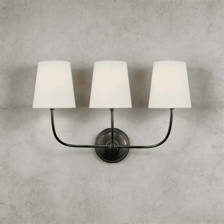 Black three-light Multi Wall Sconce with curved arms and white fabric shades